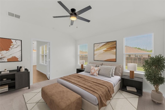 608 Silver Wing Dr, Austin, TX 78725 - bedroom featuring vaulted ceiling, ceiling fan, and light colored carpet