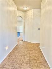 5413 Sandstone Dr, Temple, TX 76502 - hall featuring arched walkways and baseboards