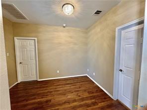 5413 Sandstone Dr, Temple, TX 76502 - spare room featuring wood finished floors and baseboards