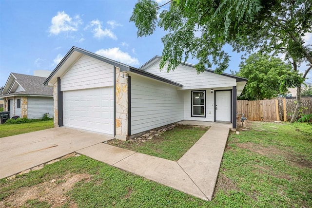 613 Broken Bow Dr, Round Rock, TX 78681 - ranch-style house featuring a garage, concrete driveway, and stone siding