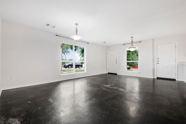 613 Broken Bow Dr, Round Rock, TX 78681 - unfurnished living room with healthy amount of natural light and finished concrete floors