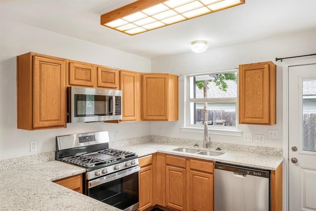 613 Broken Bow Dr, Round Rock, TX 78681 - kitchen with appliances with stainless steel finishes, healthy amount of natural light, and light stone countertops