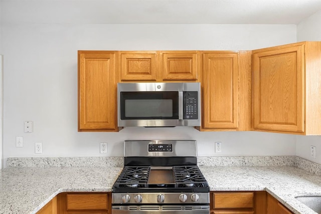 613 Broken Bow Dr, Round Rock, TX 78681 - kitchen with stainless steel appliances and light stone counters