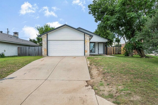 613 Broken Bow Dr, Round Rock, TX 78681 - view of front facade featuring concrete driveway, stone siding, and a garage