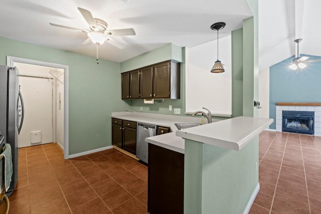 13402 Briar Hollow Dr, Austin, TX 78729 - kitchen featuring appliances with stainless steel finishes, ceiling fan, a peninsula, dark brown cabinets, and light countertops