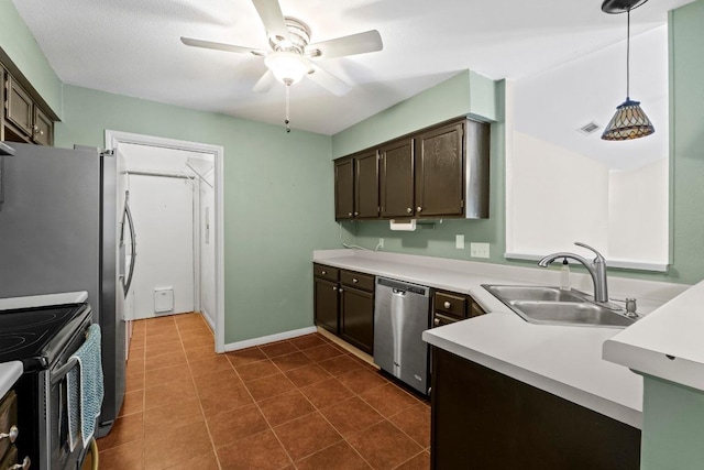 13402 Briar Hollow Dr, Austin, TX 78729 - kitchen featuring appliances with stainless steel finishes, dark brown cabinetry, ceiling fan, light countertops, and decorative light fixtures