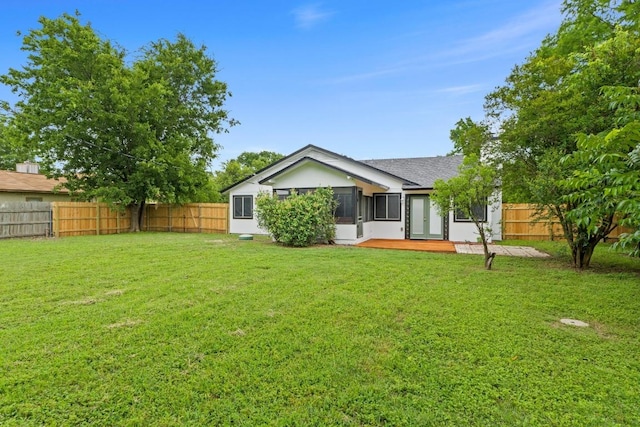 13402 Briar Hollow Dr, Austin, TX 78729 - back of house with a fenced backyard, stucco siding, and a shingled roof