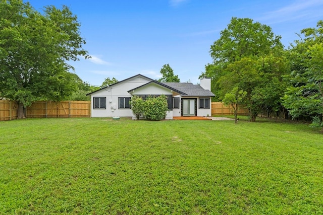13402 Briar Hollow Dr, Austin, TX 78729 - back of property featuring a fenced backyard, french doors, and stucco siding
