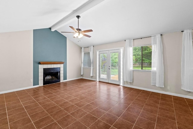 13402 Briar Hollow Dr, Austin, TX 78729 - unfurnished living room featuring ceiling fan, a tile fireplace, dark tile patterned flooring, and french doors