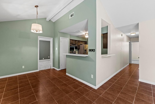 13402 Briar Hollow Dr, Austin, TX 78729 - kitchen featuring stainless steel fridge, high vaulted ceiling, light countertops, dark tile patterned floors, and dark brown cabinetry