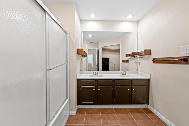 13402 Briar Hollow Dr, Austin, TX 78729 - bathroom with tile patterned floors and double vanity