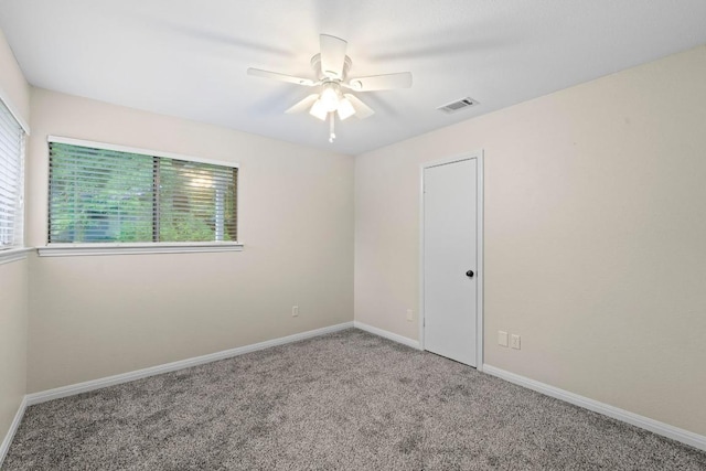 13402 Briar Hollow Dr, Austin, TX 78729 - spare room with carpet floors and a ceiling fan