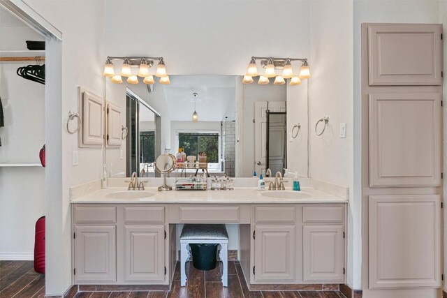 3011 Wadsworth Way, Austin, TX 78748 - bathroom featuring double vanity and wood finished floors