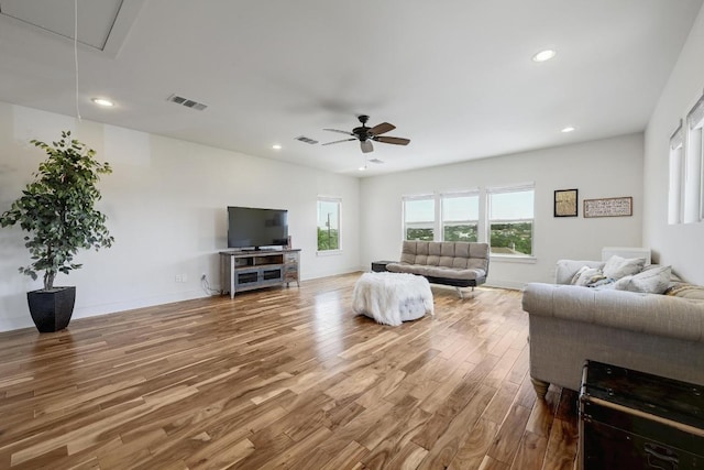 10129 Longhorn Skwy, Dripping Springs, TX 78620 - living area with attic access, wood finished floors, ceiling fan, and recessed lighting
