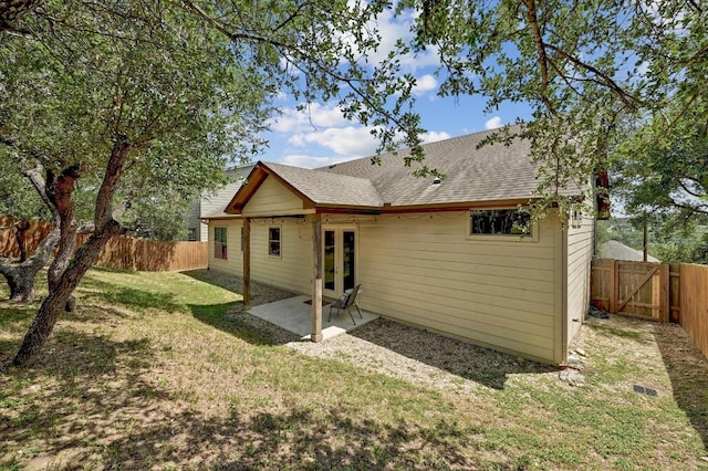 10129 Longhorn Skwy, Dripping Springs, TX 78620 - back of house with french doors, a shingled roof, a fenced backyard, and a patio area