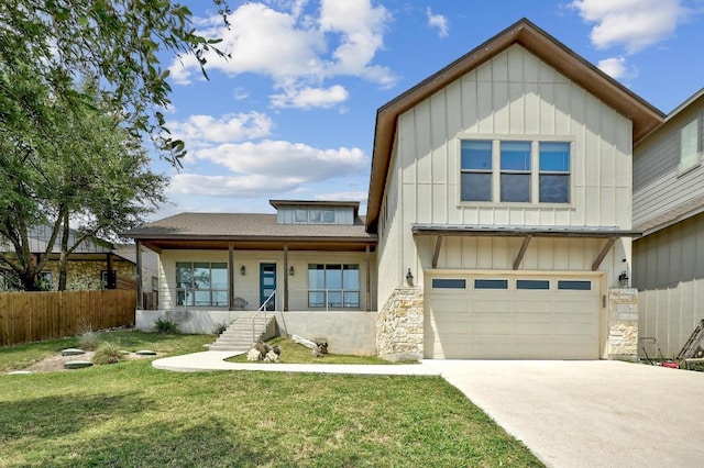 10129 Longhorn Skwy, Dripping Springs, TX 78620 - view of front of property featuring board and batten siding, a garage, concrete driveway, stone siding, and roof with shingles