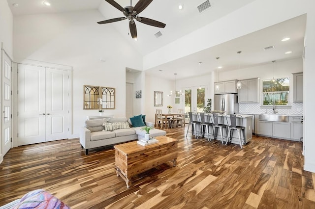 10129 Longhorn Skwy, Dripping Springs, TX 78620 - living area featuring dark wood-style floors, high vaulted ceiling, a ceiling fan, and recessed lighting