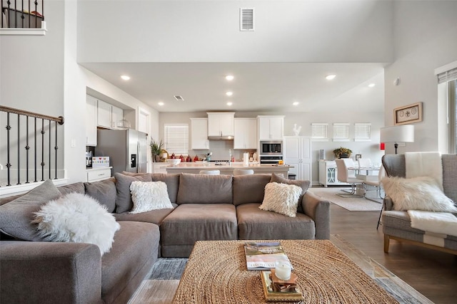 1113 Spring Gulch Ln, Georgetown, TX 78628 - living area with light wood-style flooring, recessed lighting, and a high ceiling