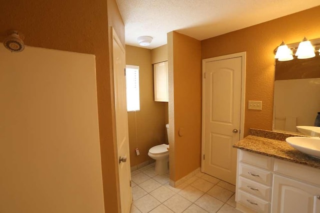 409-411 Cypress Ln, Round Rock, TX 78664 - full bath with tile patterned floors, vanity, a textured ceiling, and a textured wall