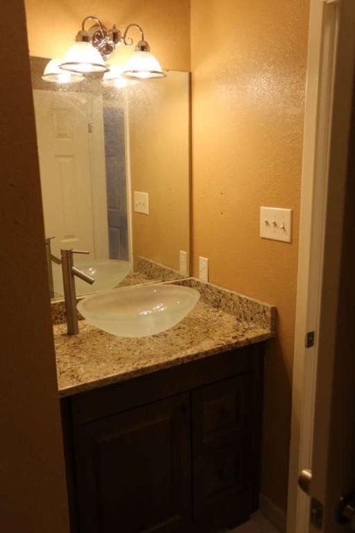 409-411 Cypress Ln, Round Rock, TX 78664 - bathroom featuring vanity and a textured wall