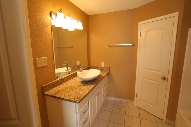 409-411 Cypress Ln, Round Rock, TX 78664 - bathroom with vanity, tile patterned floors, and a textured wall