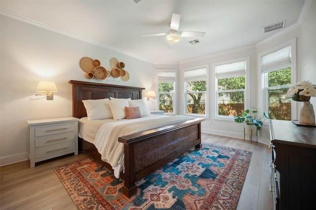 7308 Black Mountain Dr, Austin, TX 78736 - bedroom with light wood finished floors, crown molding, and a ceiling fan