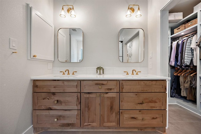 7308 Black Mountain Dr, Austin, TX 78736 - bathroom featuring double vanity and a walk in closet