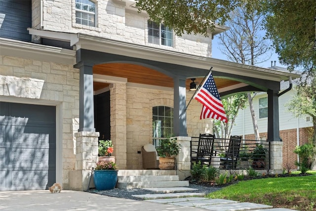 7308 Black Mountain Dr, Austin, TX 78736 - doorway to property with stone siding, covered porch, and a garage