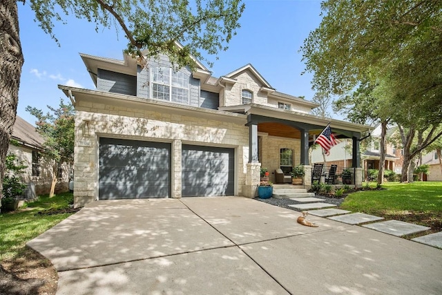 7308 Black Mountain Dr, Austin, TX 78736 - view of front of property featuring stone siding, a porch, driveway, an attached garage, and a front yard