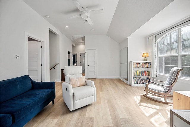 7308 Black Mountain Dr, Austin, TX 78736 - living area with light wood finished floors, ceiling fan, and vaulted ceiling