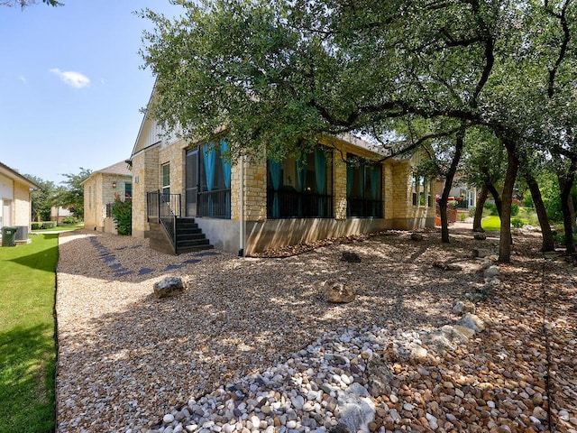 217 Skipping Cedar St, San Marcos, TX 78666 - view of side of home featuring stone siding