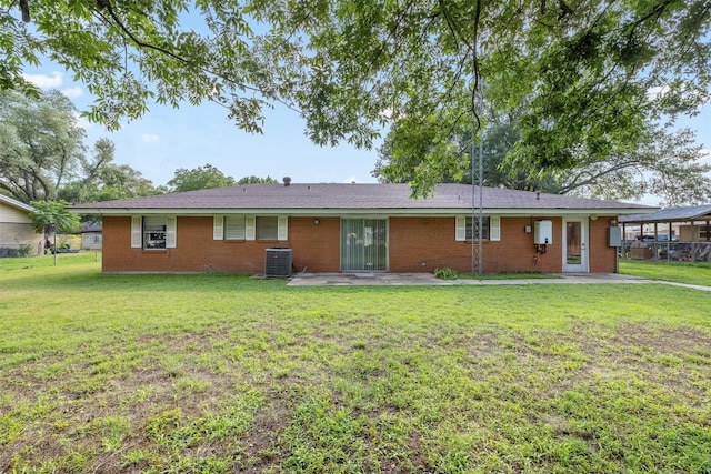 420 Hale St, Lexington, TX 78947 - ranch-style house featuring a front yard, a patio, and brick siding