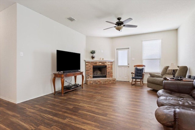 2025 Cliffbrake Way, Georgetown, TX 78626 - living area with wood finished floors, a ceiling fan, and a brick fireplace