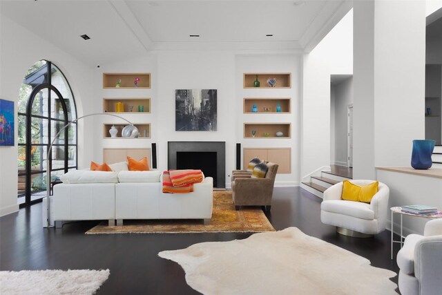 5301 Maryanna Dr, Austin, TX 78746 - living room with built in features, wood finished floors, and a fireplace