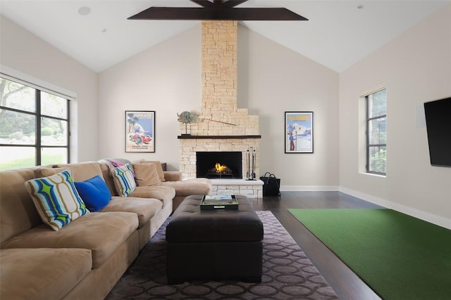 5301 Maryanna Dr, Austin, TX 78746 - living room featuring high vaulted ceiling, ceiling fan, dark wood-style floors, plenty of natural light, and a stone fireplace
