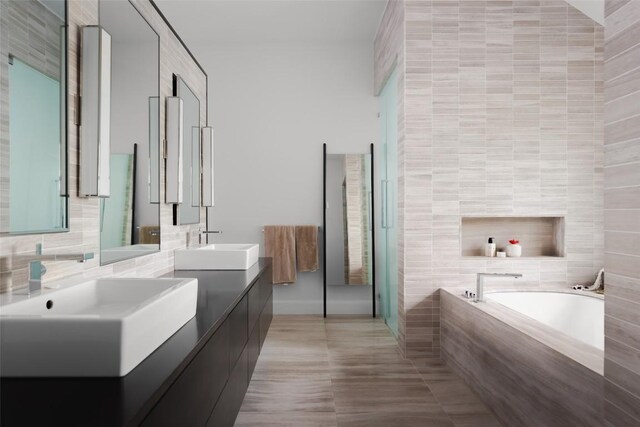 5301 Maryanna Dr, Austin, TX 78746 - full bath featuring a bath, double vanity, tile walls, tile patterned floors, and decorative backsplash