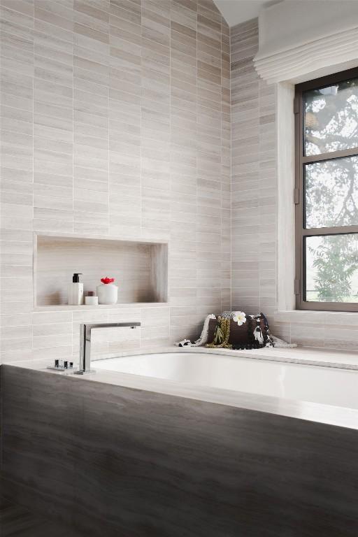 5301 Maryanna Dr, Austin, TX 78746 - bathroom featuring a garden tub and tile walls