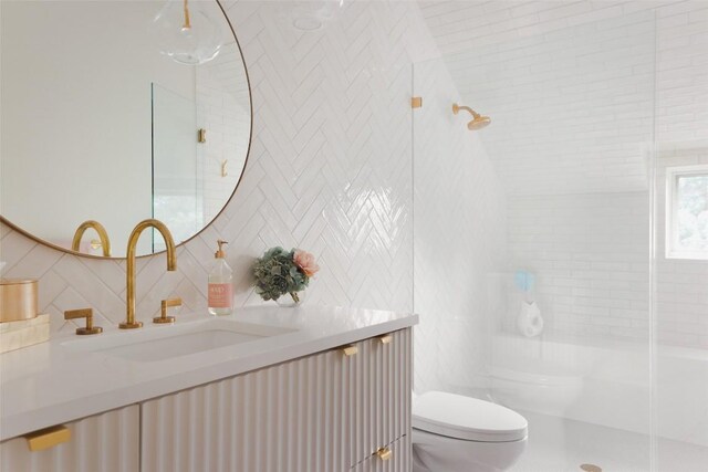 5301 Maryanna Dr, Austin, TX 78746 - bathroom featuring vanity, a shower with door, backsplash, and tile walls