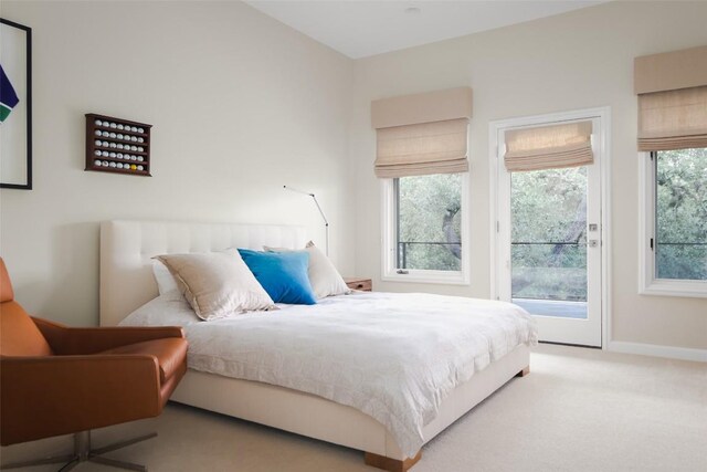 5301 Maryanna Dr, Austin, TX 78746 - carpeted bedroom featuring access to outside and baseboards