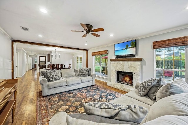 2802 Brandy Ln, Georgetown, TX 78628 - living room with ornamental molding, wood finished floors, a chandelier, ceiling fan, and recessed lighting