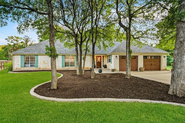 2802 Brandy Ln, Georgetown, TX 78628 - ranch-style home with concrete driveway, an attached garage, a shingled roof, a front lawn, and stucco siding