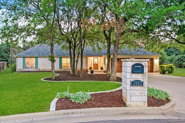 2802 Brandy Ln, Georgetown, TX 78628 - view of front of house with driveway, a shingled roof, a front lawn, and a garage