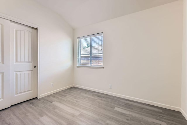1436 Biscuit Dr, Austin, TX 78754 - unfurnished room featuring light wood-style flooring and vaulted ceiling