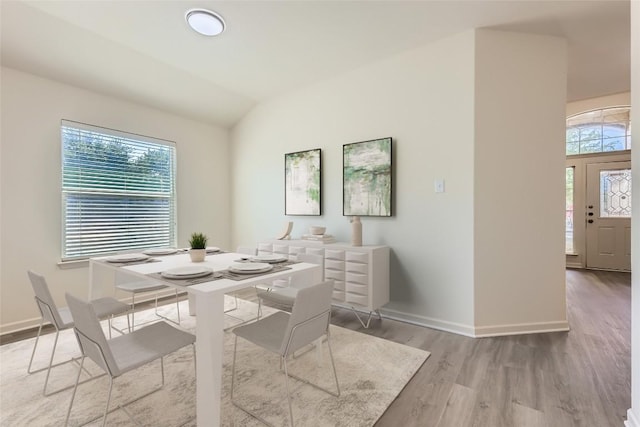 1436 Biscuit Dr, Austin, TX 78754 - dining area featuring wood finished floors, plenty of natural light, and vaulted ceiling