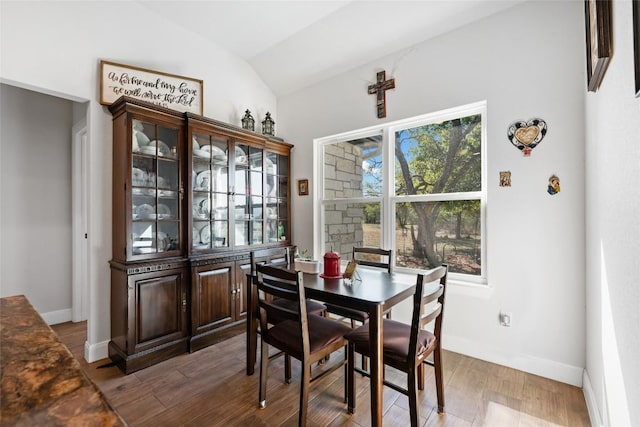 106 Chaumont St, Kingsland, TX 78639 - dining area featuring vaulted ceiling and wood finished floors