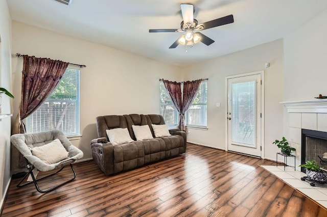 803 Ranchero Rd, Leander, TX 78641 - living room featuring hardwood / wood-style floors, a tile fireplace, and ceiling fan