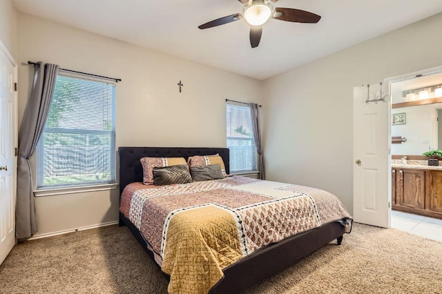 803 Ranchero Rd, Leander, TX 78641 - bedroom with light colored carpet, multiple windows, and a ceiling fan