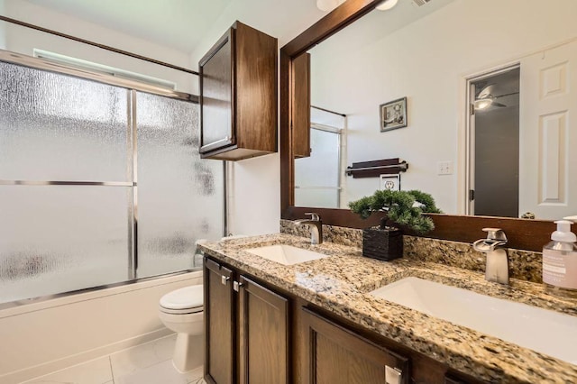 803 Ranchero Rd, Leander, TX 78641 - bathroom featuring double vanity and enclosed tub / shower combo