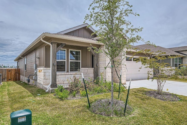2871 Mill Run Bnd, Round Rock, TX 78665 - view of front of property with board and batten siding, a garage, driveway, and stone siding