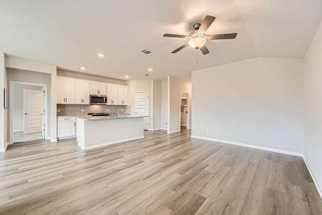 2871 Mill Run Bnd, Round Rock, TX 78665 - unfurnished living room with a ceiling fan, light wood-type flooring, and recessed lighting